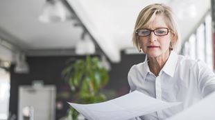 woman looking at papers