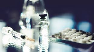  Syringe and a vial and pills