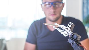 man working with robotics