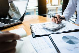 Close-up of paperwork and charts for tax filing