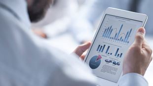 closeup of computer tablet with graphs on them