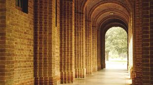 bricked curved outdoor hallway