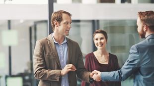 people greeting each other as they walk