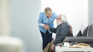 caregiver taking care of elderly