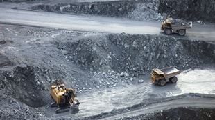 mining trucks in quarry 