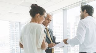 three teammembers discussing a plan