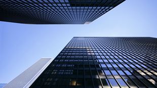  Looking up at modern office buildings on a clear, sunny day