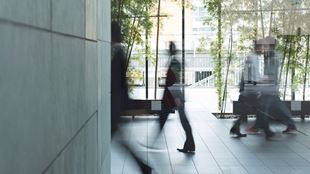 blurred photo of people walking in lobby